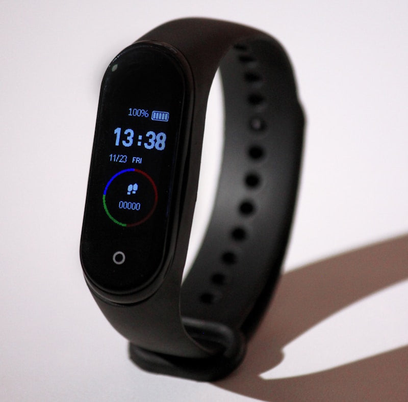 Smart fitness tracker watch showing heart rate on wrist