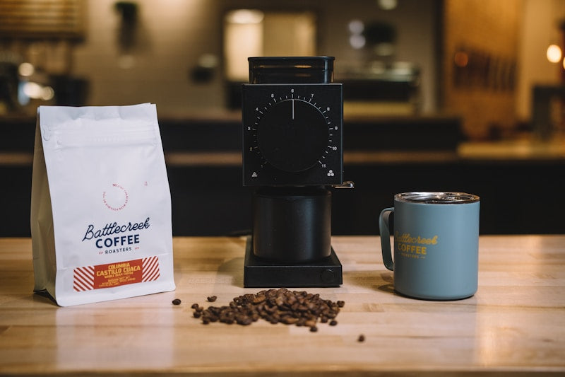 Electric spice and coffee bean grinder on kitchen counter